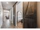 View through barn door to living room and bedroom at 2633 Garganey Dr, Castle Rock, CO 80104