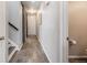 Bright entryway with tile floors, half bath, and barn door at 2633 Garganey Dr, Castle Rock, CO 80104