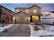 Two-story house with gray siding, attached garage, and front porch at 2633 Garganey Dr, Castle Rock, CO 80104