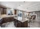 Modern kitchen with granite counters, island, and stainless steel appliances at 2633 Garganey Dr, Castle Rock, CO 80104