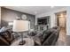 Living room with fireplace, built-in shelving, and comfortable seating at 2633 Garganey Dr, Castle Rock, CO 80104