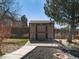 Functional backyard shed providing extra storage space in a well-maintained yard at 5175 Quari St, Denver, CO 80239