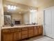 The bathroom includes a double sink vanity, large mirror, and tiled floor at 5175 Quari St, Denver, CO 80239