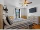 Inviting bedroom featuring stylish furnishings, a ceiling fan, and a mounted flat screen television at 5175 Quari St, Denver, CO 80239