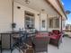 Relaxing covered patio with stylish furniture, creating an ideal space for outdoor living at 5175 Quari St, Denver, CO 80239