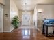 Inviting foyer with a decorative glass front door, tiled floors, and ample space to greet guests at 5175 Quari St, Denver, CO 80239