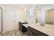 Modern bathroom with double vanity and a shower at 238 Kino Court, Brighton, CO 80601