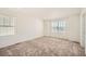 Simple bedroom with neutral carpeting and a window at 238 Kino Court, Brighton, CO 80601