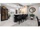 Basement bar area with a wine cooler, seating, and stylish brick accents at 5707 Cadara Way, Parker, CO 80134