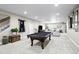 Spacious finished basement with a pool table and comfortable living area at 5707 Cadara Way, Parker, CO 80134