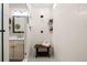 Beautiful tiled shower featuring dual shower heads, a built-in shelf and stylish wooden bench at 5707 Cadara Way, Parker, CO 80134