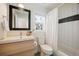 Clean bathroom with a tub and shower combination at 1152 Clayton St, Denver, CO 80206