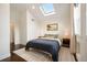 Bright bedroom with skylight, hardwood floors, and neutral decor at 1152 Clayton St, Denver, CO 80206