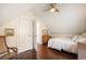 Cozy bedroom with attic style ceiling and wood floors at 1152 Clayton St, Denver, CO 80206