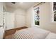 Guest bedroom with wood floors and window views at 1152 Clayton St, Denver, CO 80206