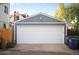 White garage door and gray siding on detached garage at 1152 Clayton St, Denver, CO 80206