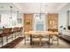 Bright dining room with live edge table and exposed brick feature wall at 1152 Clayton St, Denver, CO 80206