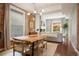 Modern dining area with live edge table and view into living room at 1152 Clayton St, Denver, CO 80206