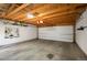 Bright, empty garage interior with overhead door and storage at 1152 Clayton St, Denver, CO 80206