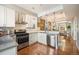 Well-equipped kitchen with stainless steel appliances, white cabinets and an open layout at 1152 Clayton St, Denver, CO 80206