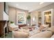 Cozy living room featuring a fireplace and large windows at 1152 Clayton St, Denver, CO 80206