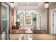 View of living room from kitchen, featuring neutral colors and natural light at 1152 Clayton St, Denver, CO 80206