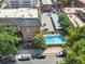 Aerial view of a building with a pool, showing the surrounding area and amenities at 1350 Josephine St # 502, Denver, CO 80206