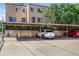 Carport parking area with an assigned parking space, offering shelter for resident vehicles at 1350 Josephine St # 502, Denver, CO 80206