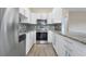 This contemporary kitchen features granite countertops, stainless steel appliances, and ample cabinet space at 1350 Josephine St # 502, Denver, CO 80206