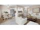 Open-concept living room and kitchen area with stainless steel appliances and counter seating at 1350 Josephine St # 502, Denver, CO 80206