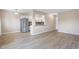 Spacious living room featuring stainless steel appliances, an open layout, and modern flooring at 1350 Josephine St # 502, Denver, CO 80206
