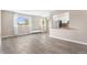 Bright living room with large windows, open to a kitchen with stainless steel appliances and ample natural light at 1350 Josephine St # 502, Denver, CO 80206