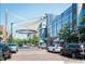 Street with businesses and cars and a building with large windows during the day at 1350 Josephine St # 502, Denver, CO 80206