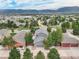 House and neighborhood view with mountain backdrop at 16911 Buffalo Valley Path, Monument, CO 80132