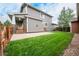 Spacious backyard with grassy lawn and patio area at 16911 Buffalo Valley Path, Monument, CO 80132