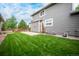 Large backyard with a grassy lawn and patio at 16911 Buffalo Valley Path, Monument, CO 80132