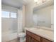 Clean bathroom with tub, shower, vanity, and mirror at 16911 Buffalo Valley Path, Monument, CO 80132