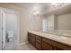 Double vanity bathroom with a toilet at 16911 Buffalo Valley Path, Monument, CO 80132