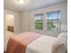 Bright bedroom with two windows and neutral decor at 16911 Buffalo Valley Path, Monument, CO 80132