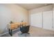 Bedroom with desk and double door closet at 16911 Buffalo Valley Path, Monument, CO 80132