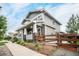 Two-story gray house with white trim, front porch, and wooden fence at 16911 Buffalo Valley Path, Monument, CO 80132