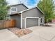 Attached two-car garage with a gray exterior at 16911 Buffalo Valley Path, Monument, CO 80132