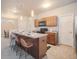 Modern kitchen with island, stainless steel appliances, and pantry at 16911 Buffalo Valley Path, Monument, CO 80132