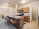 Modern kitchen with island, stainless steel appliances, and pantry at 16911 Buffalo Valley Path, Monument, CO 80132