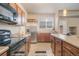 Modern kitchen featuring stainless steel appliances and ample cabinetry at 16911 Buffalo Valley Path, Monument, CO 80132