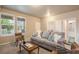 Living room with sofa, chair, and access to kitchen and bathroom at 16911 Buffalo Valley Path, Monument, CO 80132