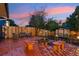 Backyard setting with paver patio, fire pit, and garden, perfect for outdoor relaxation at 18601 E Louisiana Ave, Aurora, CO 80017