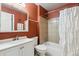 Traditional bathroom featuring a shower-tub combo with tile surround, white vanity, and neutral-toned walls at 18601 E Louisiana Ave, Aurora, CO 80017