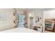 Bedroom with view of closet and three-drawer cabinet; a painting hangs on the wall at 18601 E Louisiana Ave, Aurora, CO 80017
