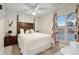 Cozy bedroom features a queen-size bed with a decorative headboard and a ceiling fan for added comfort at 18601 E Louisiana Ave, Aurora, CO 80017